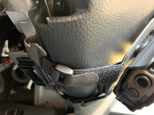 Universal under steering column pistol carrier