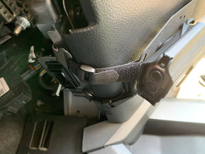 Universal under steering column pistol carrier