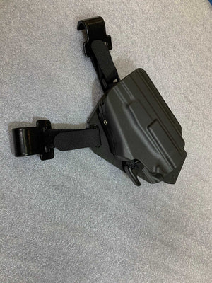 Universal under steering column pistol carrier