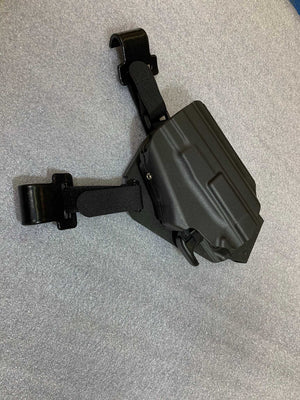 Universal under steering column pistol carrier