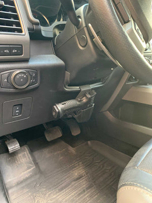 Universal under steering column pistol carrier